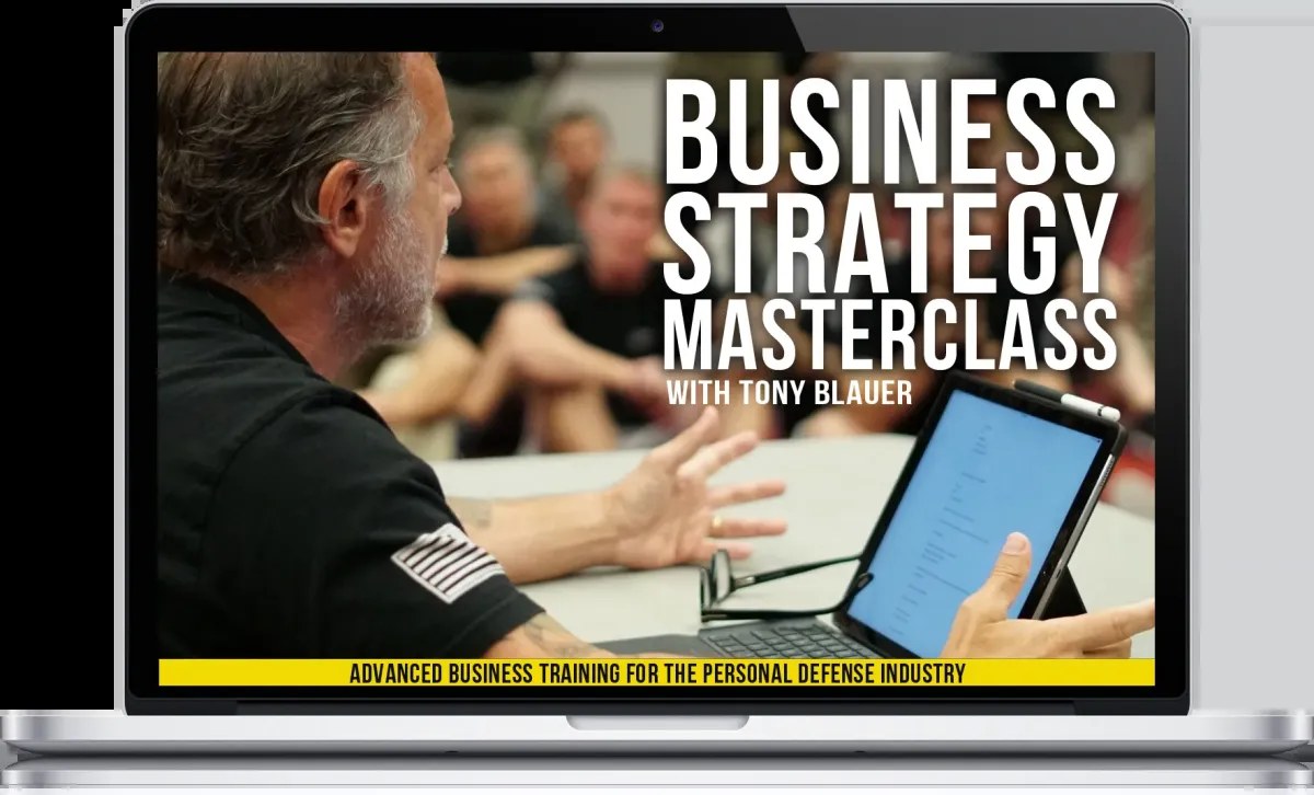 The Business Strategy Masterclass training portal on a laptop
