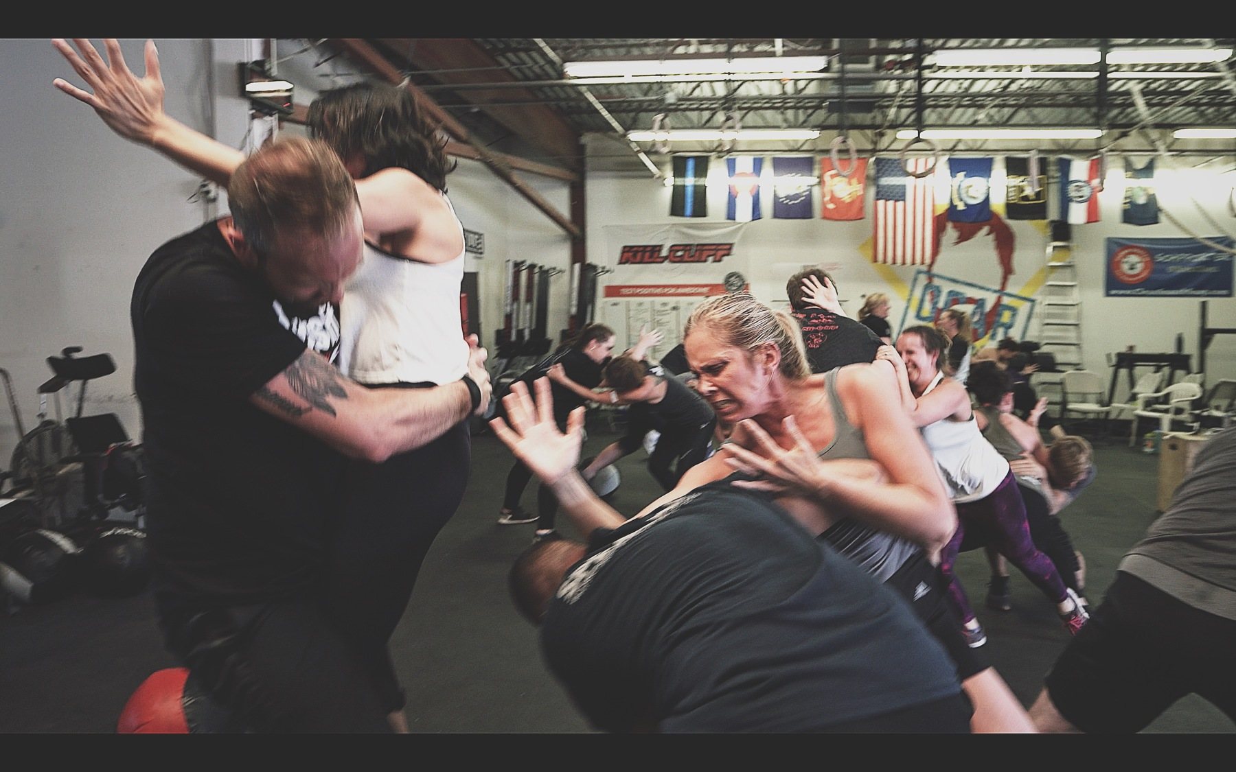 Everyday people running SPEAR System drills in a Be Your Own Bodyguard class